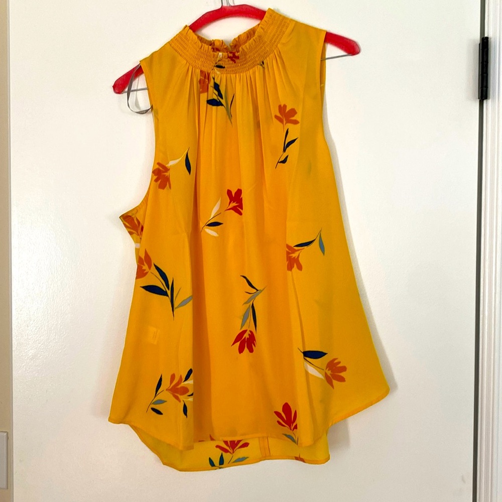 Bright yellow floral blouse